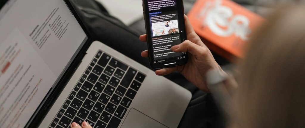 person holding black iphone 4