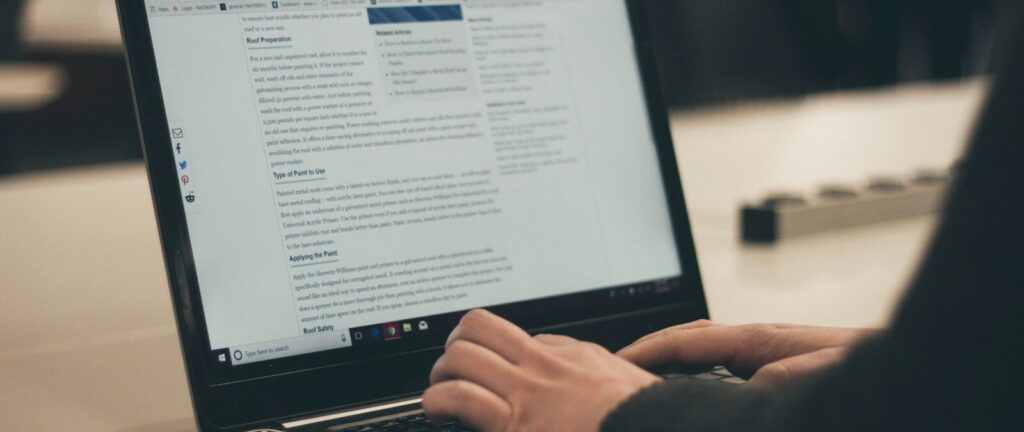 person typing on laptop computer