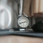 round grey alarm clock at 2:40