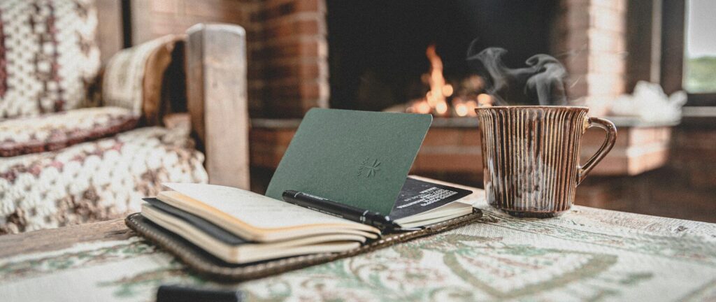 macbook pro on white and black table cloth