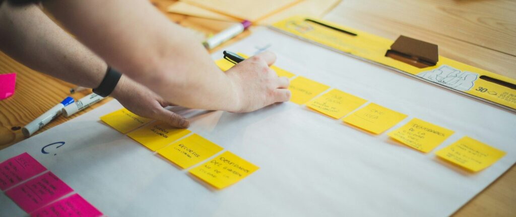 person writing on white paper