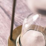 an hourglass sitting on top of a wooden table