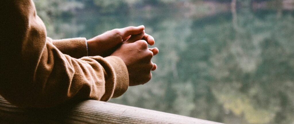 tilt-shift photography of person in brown jacket