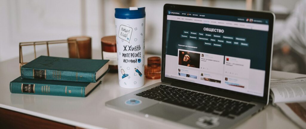a laptop computer sitting on top of a desk