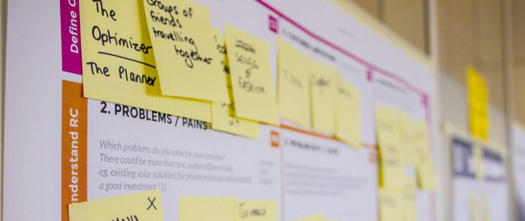 printed sticky notes glued on board