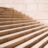 toddler's standing in front of beige concrete stair
