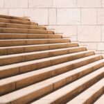 toddler's standing in front of beige concrete stair
