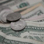 photo of dollar coins and banknotes